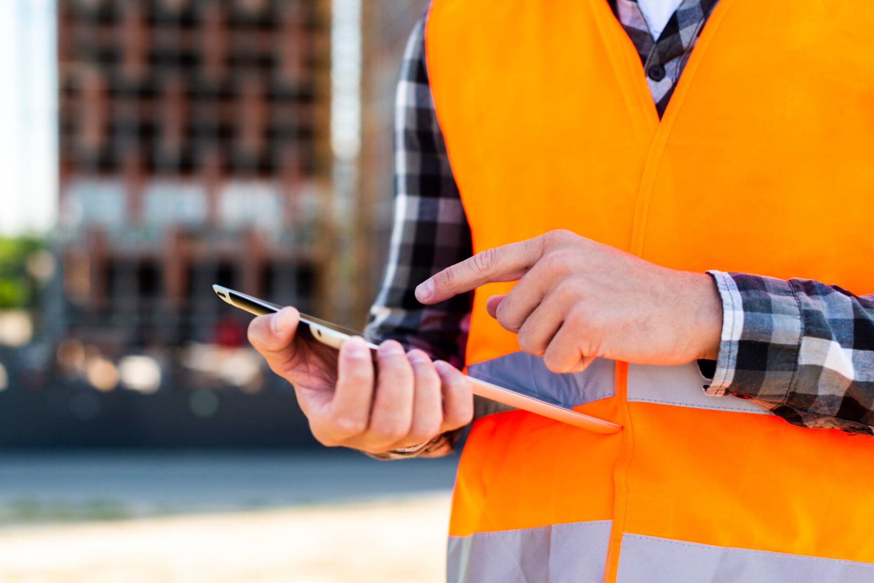close-up-construction-engineer-using-tablet